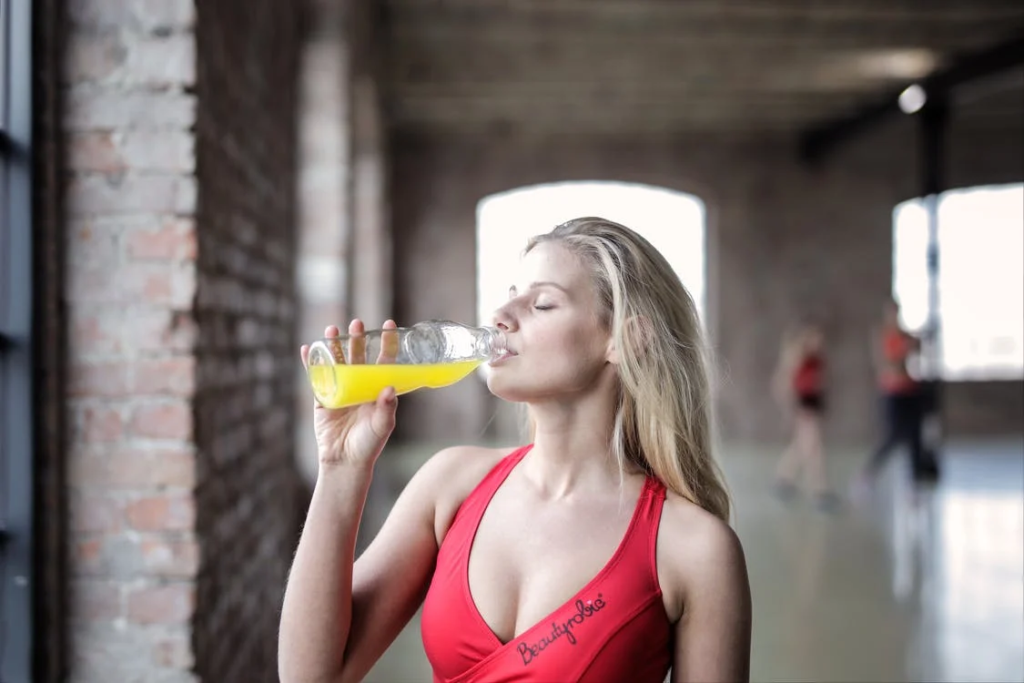 a woman drinking juice