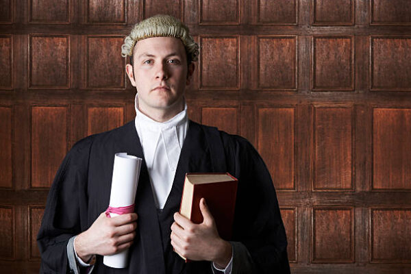 Why do lawyers wear wigs?:Who wears a dress in court?